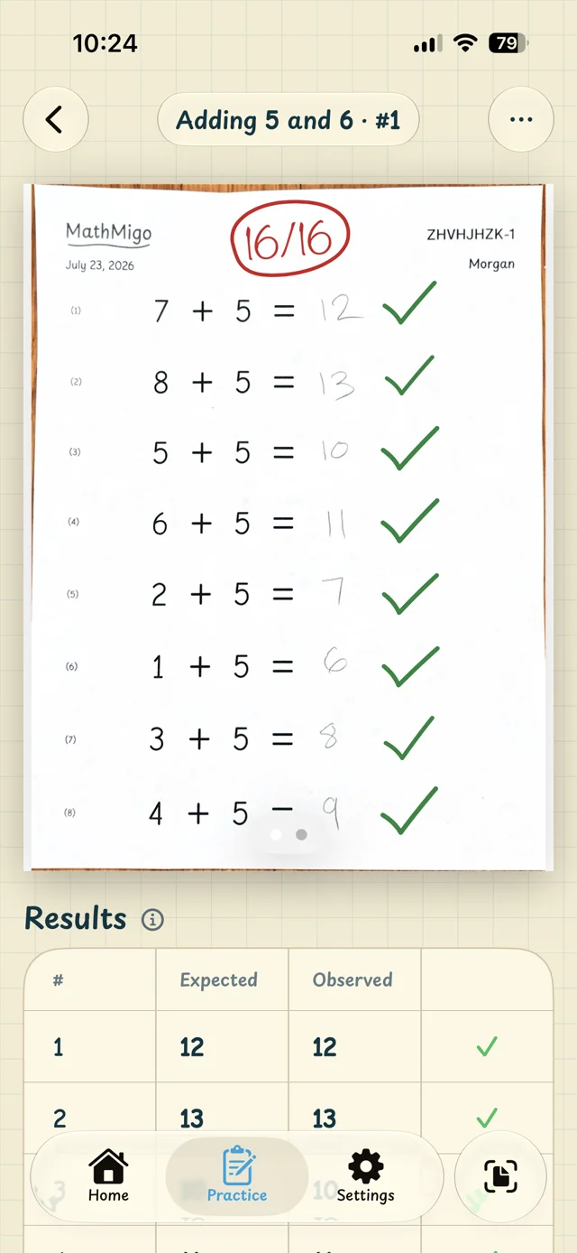 A graded worksheet in the app scored 16 out of 16 with green check marks